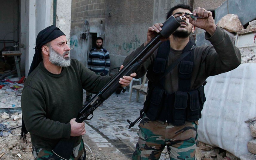 Free Syrian Army fighters prepare to launch a bomb in the direction of forces loyal to the Assad regime in Aleppo. (Reuters/Molhem Barakat)