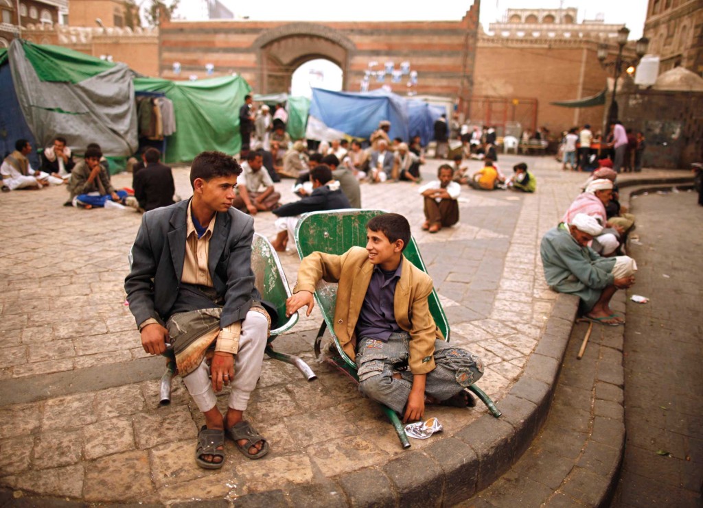 Yemeni boys wait to be hired in Sanaa