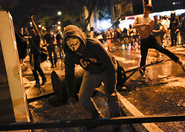 Supporters of opposition leader Leopoldo Lopez riot against police during a protest against Nicolas Maduro's government in Caracas