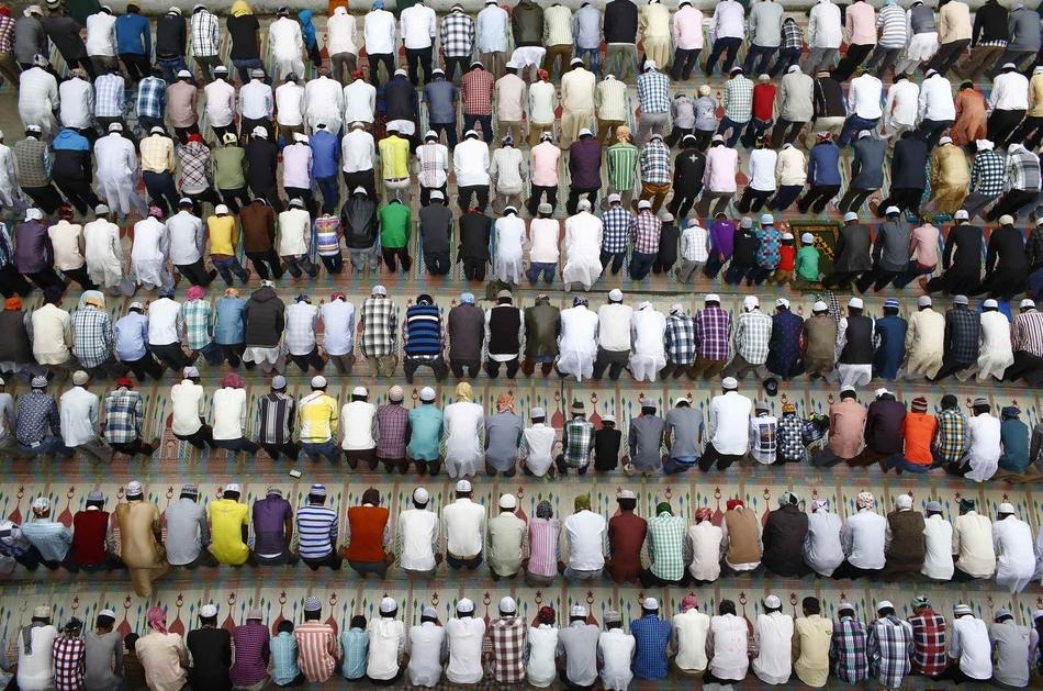 Indian Muslims attend prayers during the Eid al-Fitr festival at The Jama Masjid Mosque in New Delhi
