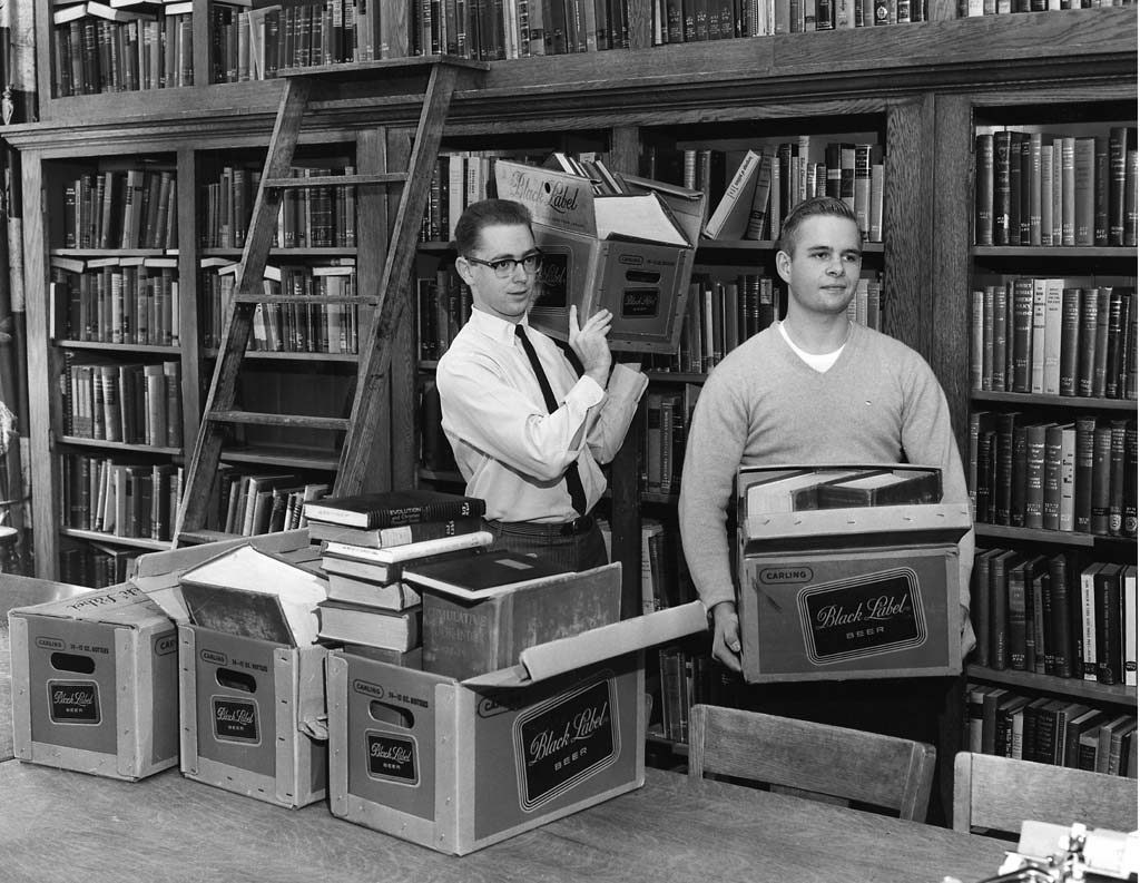 Art Cooke and James Fisher moving library books from Case Main to Sears, 1960