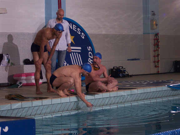 Soliman Sayed (L) prepares for his Guinness World Record-breaking jump out of the water with a monofin.