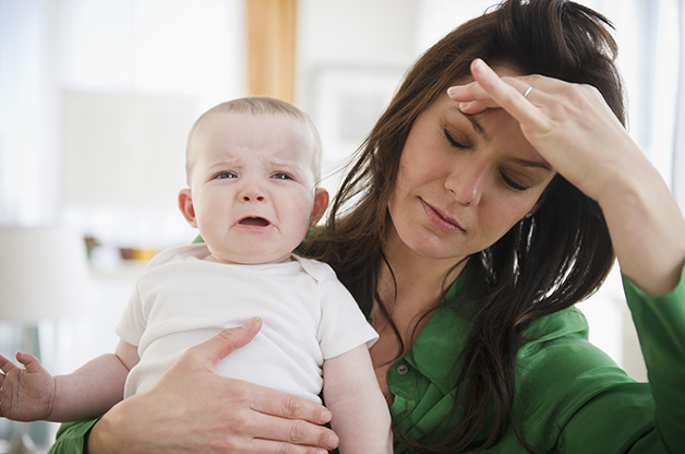 USA, New Jersey, Jersey City, Tired mother holding baby daughter (6-11 months)
