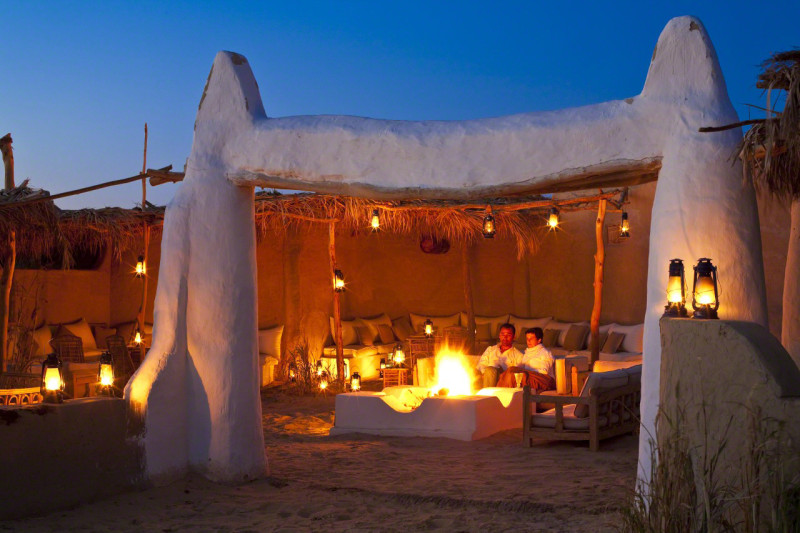 Egypt, Lower Egypt, Libyan Desert, Bahareyya Oasis, Lazuli Lodge, Ecolodge, rest by the fireside at dusk