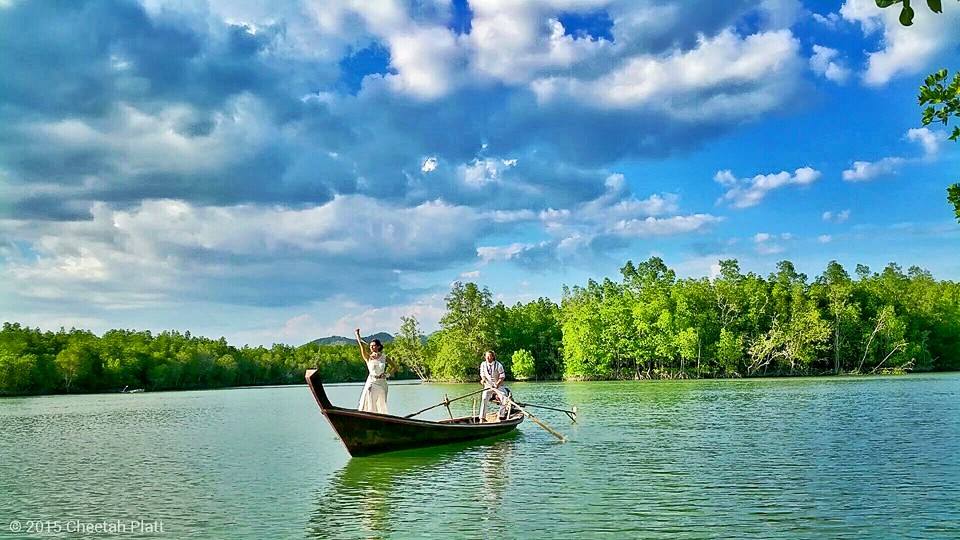 On a traditional Thai longtail boat, Phuket, Thailand (Cheetah Platt)