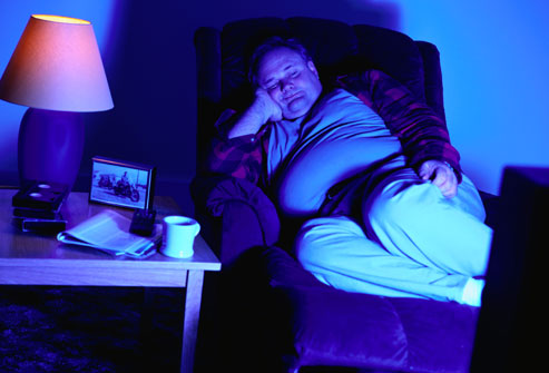 getty_rf_photo_of_man_asleep_in_front_of_television