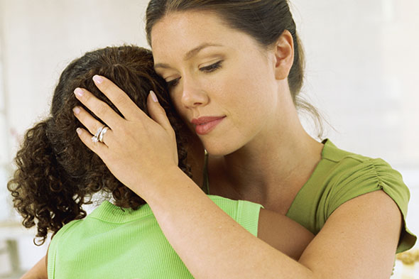 close-up of a mother hugging her daughter