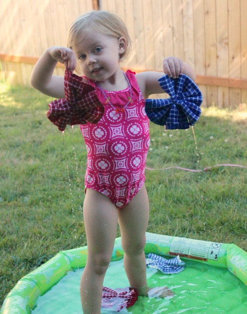 Playing-with-Wet-Washcloth-water-pom-pom-sponges