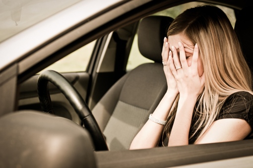 woman-upset-in-car-shutterstock-510px