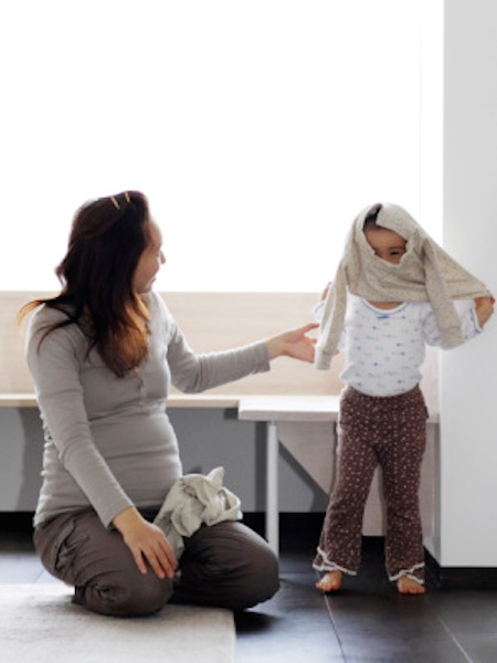 pg-toddler-independence-toddler-putting-on-shirt