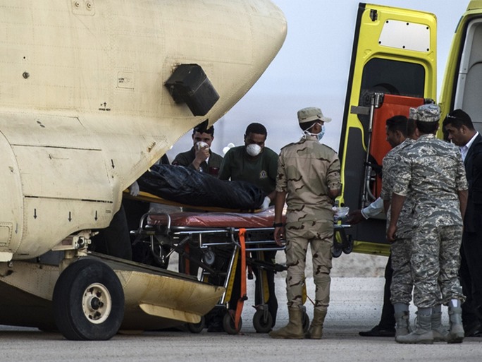 Egyptian Security and medical personnel at the site of the Russian airplane crash in Sinai, Egypt on Saturday. (Khaled Desouki/AFP/Getty Images)