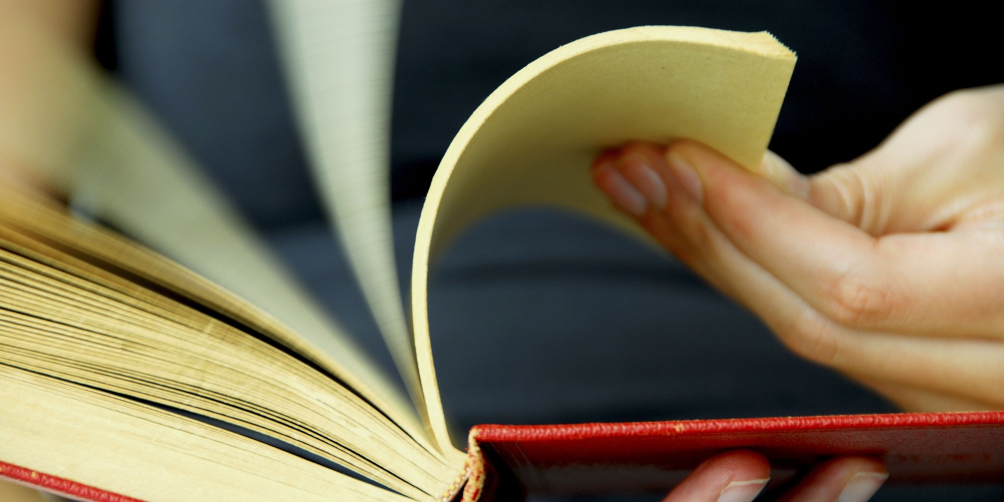 20 yr old woman flipping pages of a book