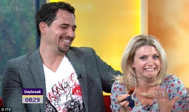 Dhafer L'Abidine laughs off the incident as reporter Anna Williamson tucks in. Via DailyMail