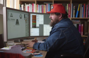 Aaron Draplin while designing a logo. Via Behind the Hustle.