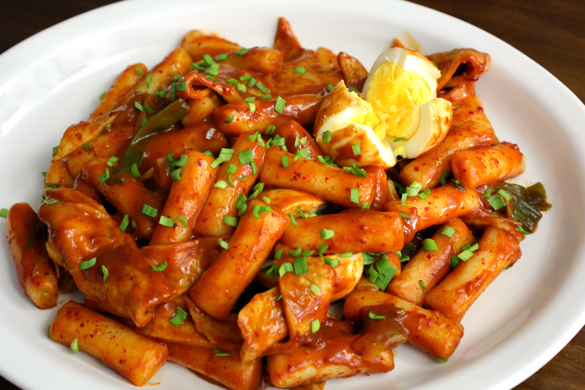 Tteokbokki is a popular Korean food made from soft rice cake, fish cake, and the sweet red chili sauce called gochujang. Via Maangchi.