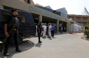 Egyptian police personnel stand guard outside Dar Al Fouad Hospital, where injured tourists who were mistakenly targeted in a military operation "chasing terrorist elements" are recovering, in Cairo, Egypt, in this file September 14, 2015 photo. REUTERS/Mohamed Abd El Ghany
