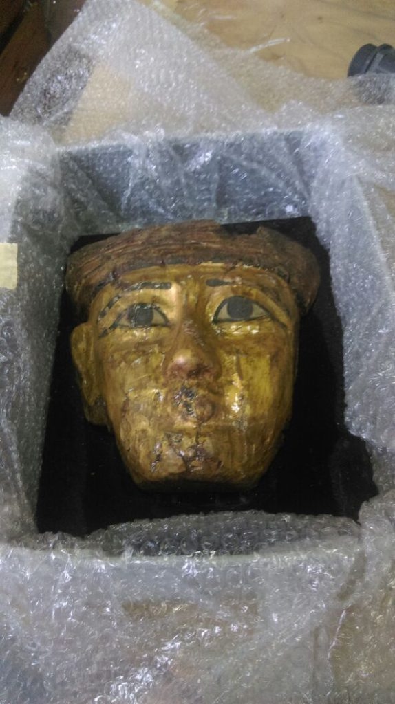 Mummy mask returned to the Ministry of Antiquities. (Photo courtesy Ministry FB page)