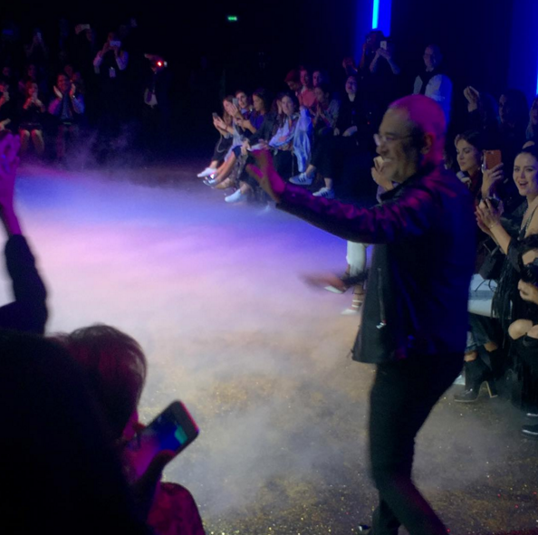 Elie Saab saluting audience after Paris Fashion Week Show via Dyma Demirdjian's Instagram