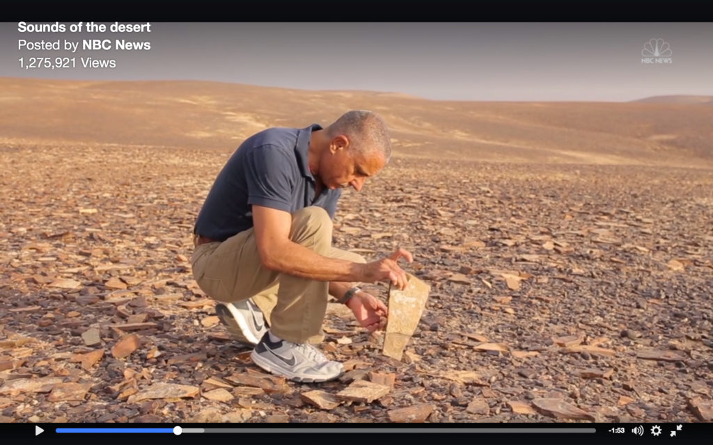 Ammar Khammesh tests flint stones in the Jordanian desert (screencap from 'Sound of the Desert')