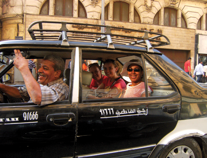 A taxi driver in Downtown Cairo making jokes with his customers. Via Keyword Suggestions