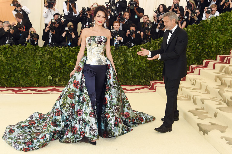 https://www.usmagazine.com/stylish/news/met-gala-2018-george-clooney-jokes-their-kids-are-under-amals-outfit/